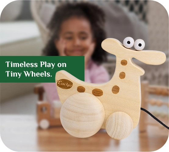 https://lacherstore.com/wp-content/uploads/2026/06/GiggleSaurus™-Timeless-Play-on-Tiny-Wheels-copy-2.webp